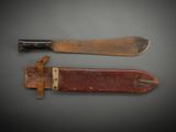 pair of two knives with wooden handles on a gray surface