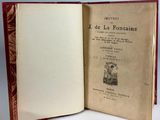 an open book with a picture of a man and a dog on it