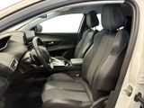 the interior of a car with the door open and the driver ' s seat down