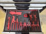 many tools in a case that are sitting on the floor