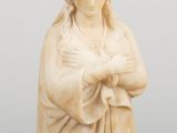 marble statue of a woman holding a baby in her arms