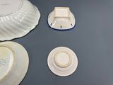 three plates and a bowl on the table
