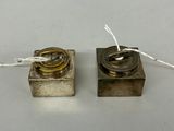 pair of antique silver plated candles with wire wrapped around them