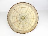 a large piece of wood that has a circular design on it
