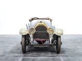 a very old car that is parked in a parking lot