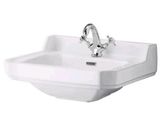 un lavabo de salle de bains blanc équipé d'un robinet chromé