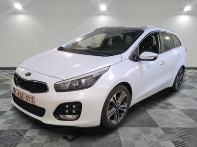 a white car is parked in a room with a checkered floor