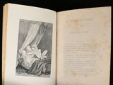 an open book with a picture of a baby in a crib