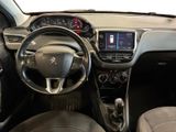 the interior of a small car with a steering wheel and dashboard