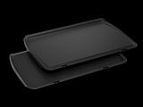 two black trays on top of each other on a black surface