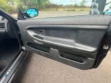 the door of a car with the driver ' s side door open