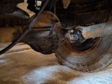 a close up view of a vehicle ' s tire and wheel