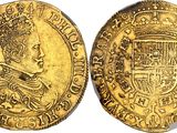 a gold coin with a crown on top of it