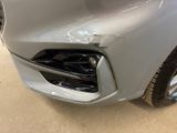 a picture of a car that has been dented and dented