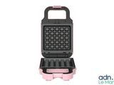 a close up of a waffle maker on a white background