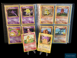 a lot of pokemon cards that are in a case