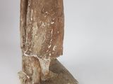 an old statue of a woman holding a bird on a white background