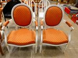 two chairs that are sitting next to each other on the floor