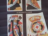 une affiche représentant quatre cartes à jouer posées sur une table