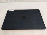 an apple macbook pro laptop sitting on top of a white surface