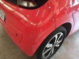 a red car that is parked in a garage