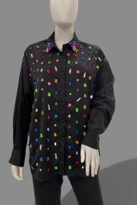 black button up shirt with multi - colored buttons on a mannequin head