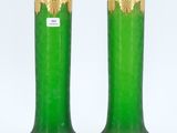 pair of green and gold vases on a white background
