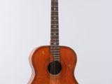 a close up of a guitar on a stand against a white background