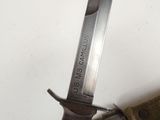 a knife that is laying on top of a piece of cloth