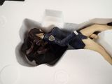 a doll that is laying down in a box