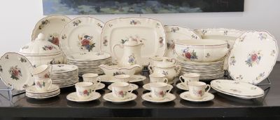 a table with a bunch of plates and cups on it