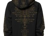 a woman wearing a black hoodie with a cross on it