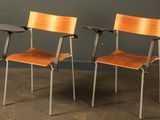 two chairs sitting next to each other in a room