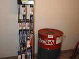 a picture of a room with a drum and a rack of dvds