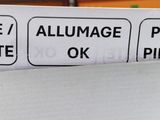 a close up of a box of pizza with a price tag on it