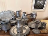 a table with a lot of silver items on it