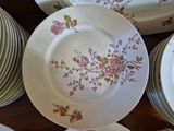 a lot of plates that are sitting on a table