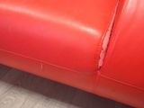 an image of a red leather couch in a living room