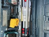 a tool box with tools inside of it on the floor
