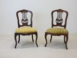 pair of antique chairs with upholstered back and upholstered seat