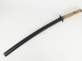 a close up of a samurai sword on a white surface