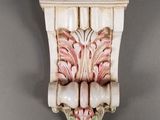 a close up of a decorative object on a gray wall