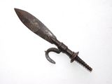 a picture of an old rusty knife on a white surface