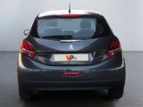 the rear view of a black car with a white top and red tail lights
