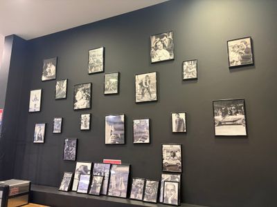 a wall with many pictures of people on it