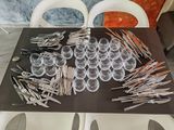 a table with a bunch of forks and spoons on it