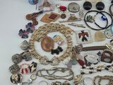 a pile of assorted jewelry sitting on a table