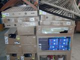 a cart with boxes and a fan on it in a warehouse