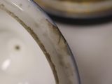 a close up view of a white bowl on a table