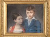 portrait d'un garçon et d'une fille dans un cadre doré